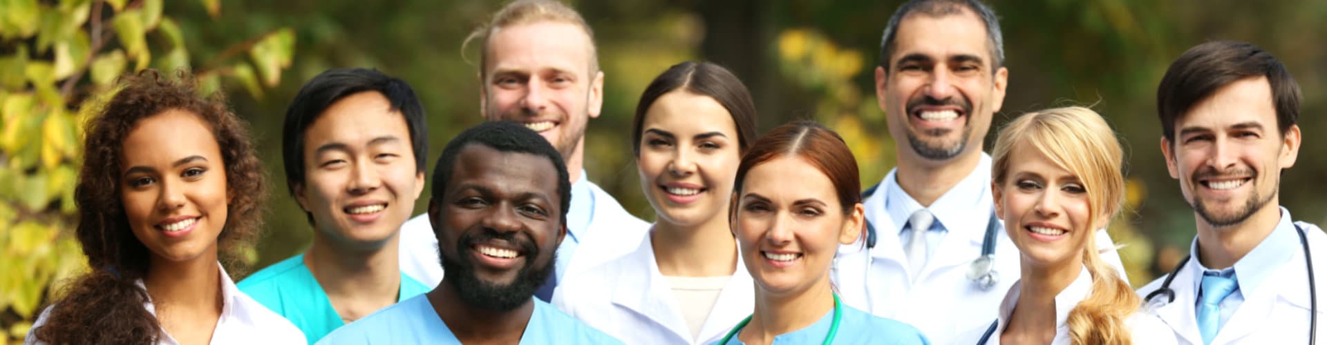 multiracial doctors smiling at camera