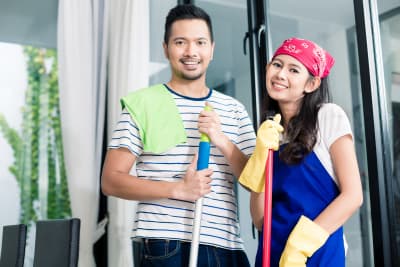 young people cleaning home