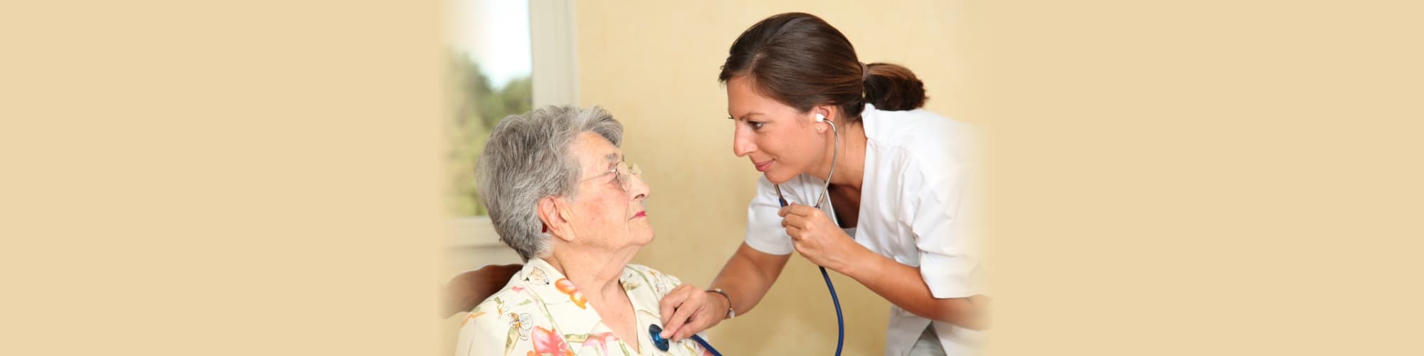 Elderly person with nurse at home