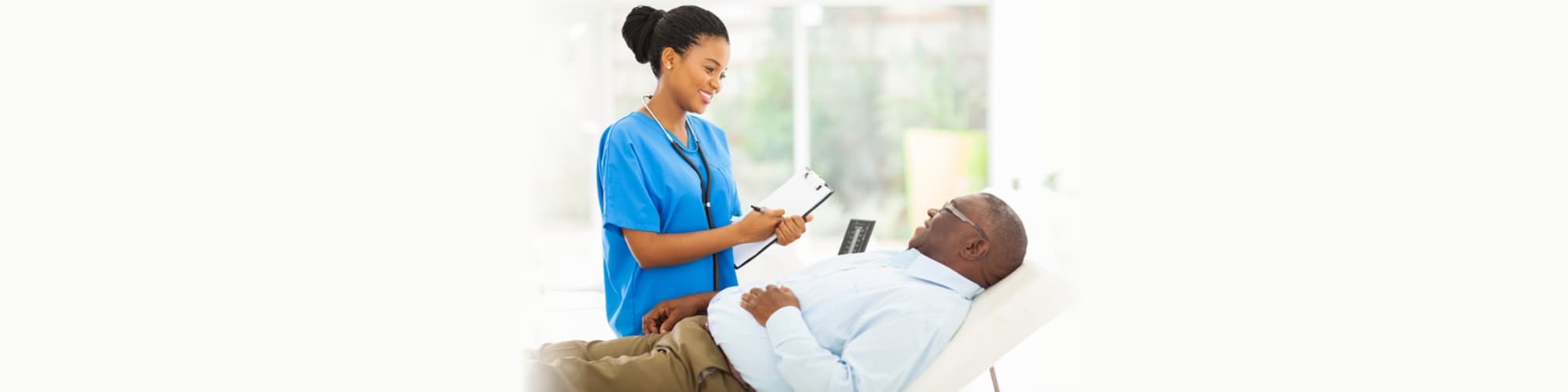 African doctor consulting senior patient